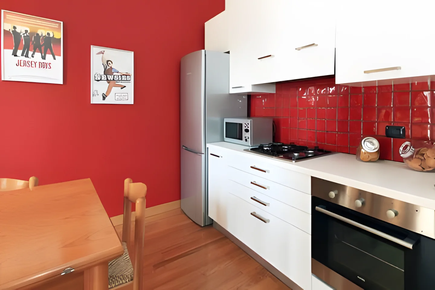 The kitchen and living room, bright with natural light